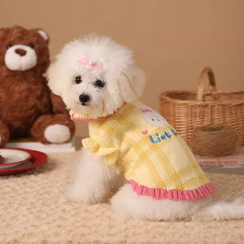 Yellow bunny bow patch knit pet sweater worn by a small dog