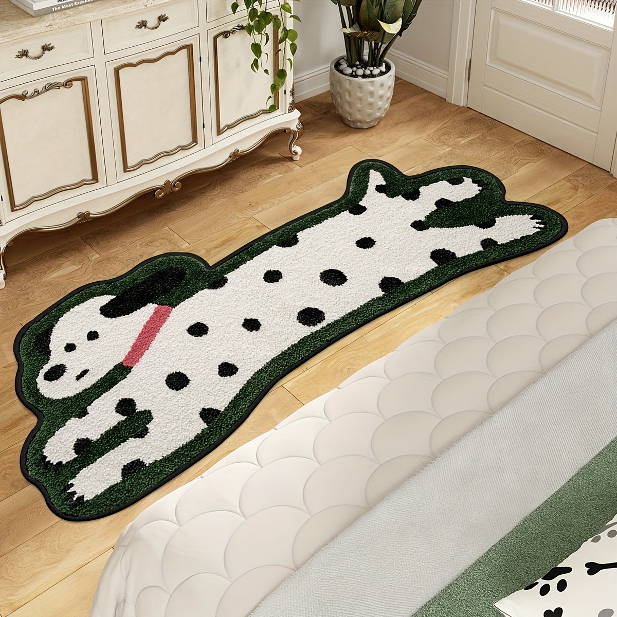 Green spotted dog shaped plush bedside mat in a bedroom