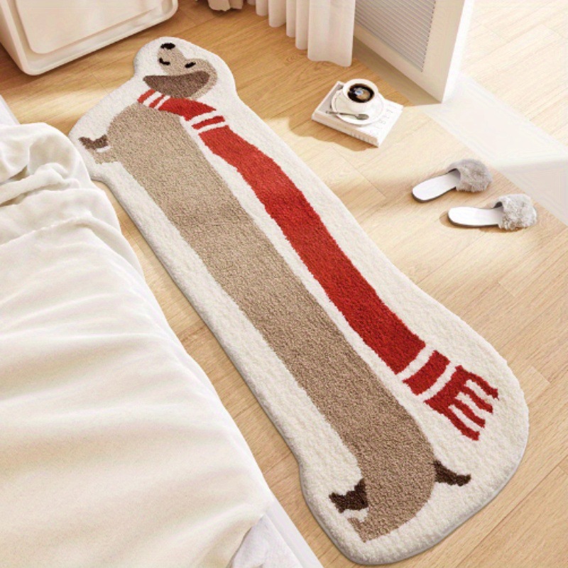 Red scarf dog shaped plush bedside mat on a bedroom floor